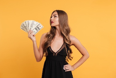 Girl showing money and glamour 