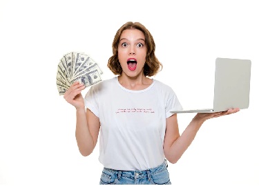 a girl with money and laptop