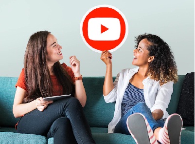 two girls holding youtube logo