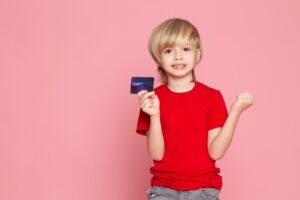 kids holding a credit card 
